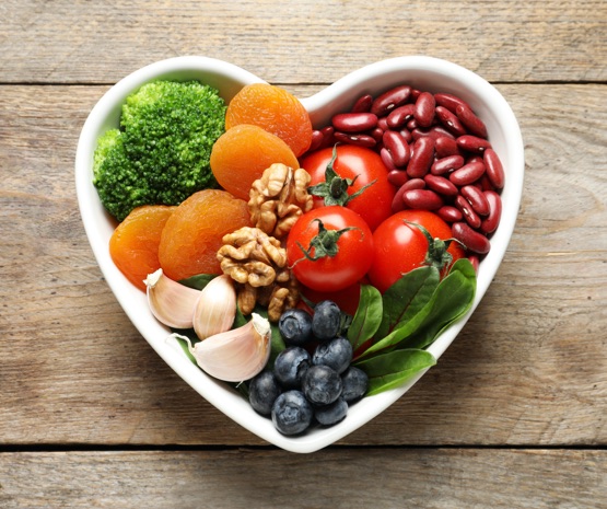 Heart shaped bowl of healthy vegetables